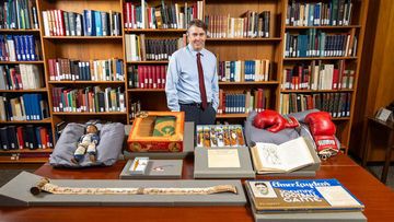 A fan of history and sports, the archivist found a rare job that blends those interests.